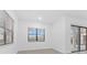 Bright bedroom with large windows and neutral paint, offers a serene and comfortable living space at 1205 Butterfly Orchid Rd, Davenport, FL 33837