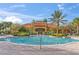 Resort-style community pool with a beautiful clubhouse, offering a luxurious swimming experience at 1205 Butterfly Orchid Rd, Davenport, FL 33837