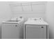 Functional laundry room featuring new, high efficiency washer and dryer at 1205 Butterfly Orchid Rd, Davenport, FL 33837