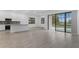 Open-concept living room with tile floors, a view of the kitchen, and sliding doors to the pool at 1205 Butterfly Orchid Rd, Davenport, FL 33837