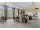 Elegant lounge area with comfortable sofas, large windows, and stylish decor, ideal for relaxation at 1205 Butterfly Orchid Rd, Davenport, FL 33837
