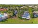 Community playground with mature landscaping in a well-maintained community setting, next to pool and clubhouse at 1205 Butterfly Orchid Rd, Davenport, FL 33837