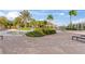 Expansive community pool area with lounge chairs and umbrellas, ideal for relaxation and socializing at 1205 Butterfly Orchid Rd, Davenport, FL 33837