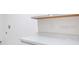Clean, bright laundry room with solid surface countertops at 13 Bradford Ct, Kissimmee, FL 34758