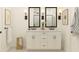 Elegant bathroom features a double vanity with black fixtures and patterned floor tiles at 13252 Sw 85Th Cir # 58, Ocala, FL 34473