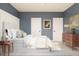 Stylish bedroom with blue walls, white trim, and modern furnishings at 13252 Sw 85Th Cir # 58, Ocala, FL 34473