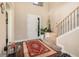 Inviting foyer with a staircase, decorative rug, and plenty of natural light at 14486 Sunbridge Cir, Winter Garden, FL 34787