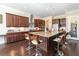 Well-equipped kitchen with stainless steel appliances, a center island, and custom cabinetry at 14486 Sunbridge Cir, Winter Garden, FL 34787