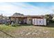 Backyard featuring a covered patio area, shed, and plenty of space for outdoor activities at 14884 Sw 35Th Cir, Ocala, FL 34473