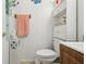 Bathroom featuring a toilet, vanity, and white shelving unit at 14884 Sw 35Th Cir, Ocala, FL 34473