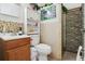 Cozy bathroom featuring stone-look shower, pedestal sink, and decorative details at 14884 Sw 35Th Cir, Ocala, FL 34473