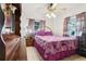 Cozy bedroom with purple accents, tile flooring, and a ceiling fan at 14884 Sw 35Th Cir, Ocala, FL 34473