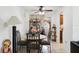 Inviting dining area with a round table, seating for four, and an adjacent workstation at 14884 Sw 35Th Cir, Ocala, FL 34473