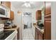Well-lit kitchen featuring tile floors, updated appliances, and ample counter space at 14884 Sw 35Th Cir, Ocala, FL 34473