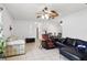 Spacious open-concept living room with tiled floors, lots of seating, and a dining table at 14884 Sw 35Th Cir, Ocala, FL 34473