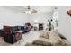 Bright living room featuring neutral walls, tile floors, and comfortable seating with a ceiling fan at 14884 Sw 35Th Cir, Ocala, FL 34473