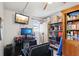 Bright office area featuring computer, wall-mounted television and plenty of storage space at 14884 Sw 35Th Cir, Ocala, FL 34473