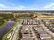 An aerial view shows the layout of the neighborhood with its houses, roads, ponds, and nature at 17087 Wynford Ln, Winter Garden, FL 34787