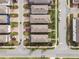 Overhead aerial view shows brick paved drives and sidewalks and expertly manicured landscaping at 17087 Wynford Ln, Winter Garden, FL 34787