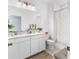 Bathroom featuring double sink vanity and walk-in shower at 17087 Wynford Ln, Winter Garden, FL 34787