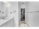 Bathroom with vanity and view to the walk-in closet at 17087 Wynford Ln, Winter Garden, FL 34787