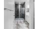 Bathroom showcasing glass shower, granite details and tile floor at 17087 Wynford Ln, Winter Garden, FL 34787