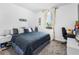Bright bedroom with a dark blue bed at 17087 Wynford Ln, Winter Garden, FL 34787