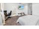 Bedroom featuring a white comforter, desk, and TV at 17087 Wynford Ln, Winter Garden, FL 34787
