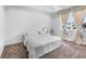 Neutral bedroom with large windows and a plush carpet at 17087 Wynford Ln, Winter Garden, FL 34787
