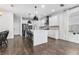 Spacious kitchen featuring a center island, stainless steel appliances, and wood flooring at 17087 Wynford Ln, Winter Garden, FL 34787