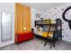 Bedroom featuring bunk beds, red cabinet, and a Mickey Mouse themed decor at 2145 Fleming Mist Pl, Kissimmee, FL 34747