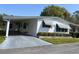 Charming single-story residence features a carport and well-kept landscaping, offering a welcoming curb appeal at 223 Pinewood Dr, Eustis, FL 32726
