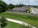 Rear aerial view of home featuring a fenced yard and a picturesque green space behind the property at 2271 Delhi Pl, Sanford, FL 32771