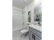 Bright bathroom features a shower-tub combination, tropical themed artwork, and modern vanity at 2271 Delhi Pl, Sanford, FL 32771