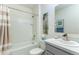 Well-lit bathroom featuring a shower-tub combo and a single sink vanity with gray cabinets at 2271 Delhi Pl, Sanford, FL 32771