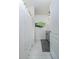 Bright bathroom with shower featuring white shower curtain, gray vanity and earth-tone accent pictures at 2271 Delhi Pl, Sanford, FL 32771
