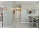Dining area features modern decorations, large mirror, seating for four, and neutral colors at 2271 Delhi Pl, Sanford, FL 32771