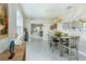 Dining room with a modern light fixture and a large mirror on the back wall at 2271 Delhi Pl, Sanford, FL 32771