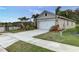 Charming single-Gathering home featuring a well-manicured lawn and landscaping, a two-car garage, and a spacious driveway at 2271 Delhi Pl, Sanford, FL 32771