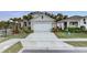 Well-maintained single-story home featuring tropical landscaping and a spacious driveway at 2271 Delhi Pl, Sanford, FL 32771