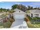 Charming single-Gathering home featuring a well-manicured lawn and landscaping, a two-car garage, and a spacious driveway at 2271 Delhi Pl, Sanford, FL 32771