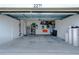 Spacious two-car garage with ample storage space, overhead racks and epoxy flooring at 2271 Delhi Pl, Sanford, FL 32771