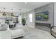 Bright living room featuring a sleek fireplace with television and comfortable modern seating at 2271 Delhi Pl, Sanford, FL 32771