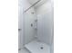 Clean, bright shower features modern shower head, tiled surround, and molded shelving for toiletries at 2271 Delhi Pl, Sanford, FL 32771