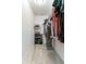 Functional walk-in closet with shelving, clothing rack, and storage for shoes and accessories at 2271 Delhi Pl, Sanford, FL 32771