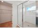Bathroom showcases a tiled shower with glass doors and a view to the outside at 2354 Broadbrook Dr, St Cloud, FL 34771