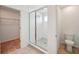 Bathroom featuring a tiled shower with glass doors and adjacent walk-in closet at 2354 Broadbrook Dr, St Cloud, FL 34771