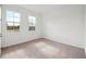 Bedroom with neutral carpet, two windows offering outdoor views, and bright natural light at 2354 Broadbrook Dr, St Cloud, FL 34771