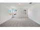 Large bedroom filled with neutral carpet, multiple windows that provide an abundance of natural light, and serene atmosphere at 2354 Broadbrook Dr, St Cloud, FL 34771