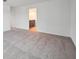 Bright bedroom with neutral walls and flooring leading to an attached bathroom at 2354 Broadbrook Dr, St Cloud, FL 34771